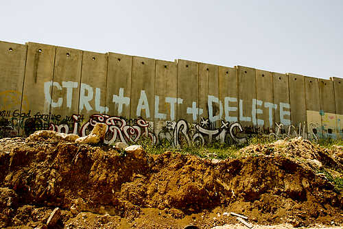 “The barrier -graffiti painted- West Bank - Palestine”. This file is licensed under the Creative Commons Attribution-Share Alike 2.0 Generic license.